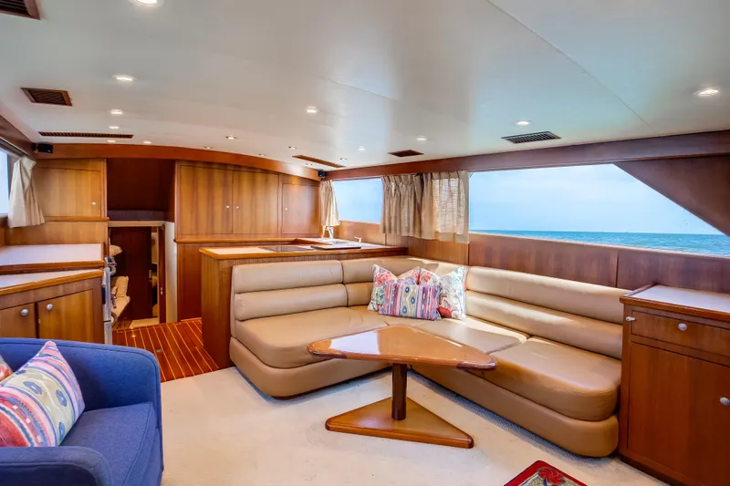 Spiros Yacht Photos Pics Luxurious 1972 Jim Smith Custom Convertible yacht interior with elegant wood finishes and ocean view.