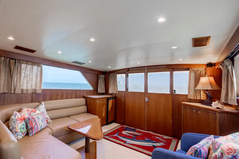 Spiros Yacht Photos Pics Luxurious 1972 Jim Smith Custom Convertible yacht interior with ocean view and elegant furnishings.