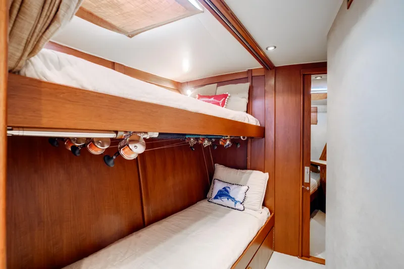 Spiros Yacht Photos Pics 1972 Jim Smith Custom Convertible interior with wooden bunk beds and fishing rods.