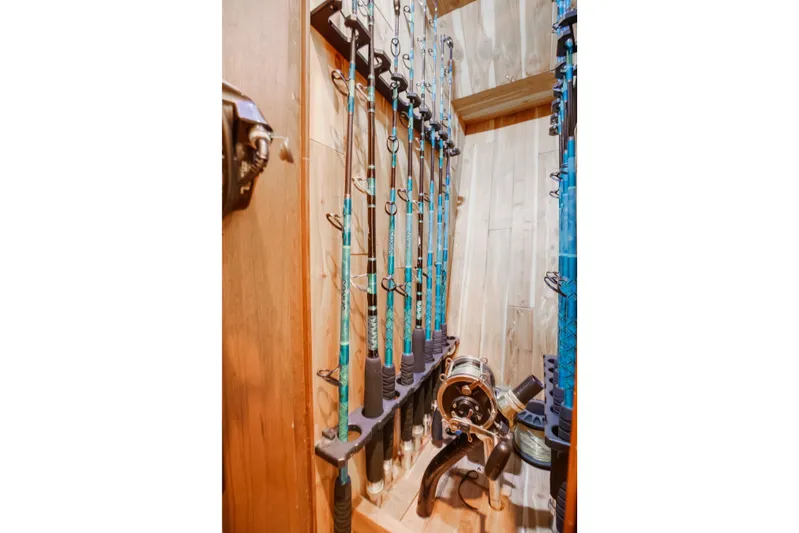 Spiros Yacht Photos Pics Fishing rods stored in a wooden compartment of a 1972 Jim Smith Custom Convertible.