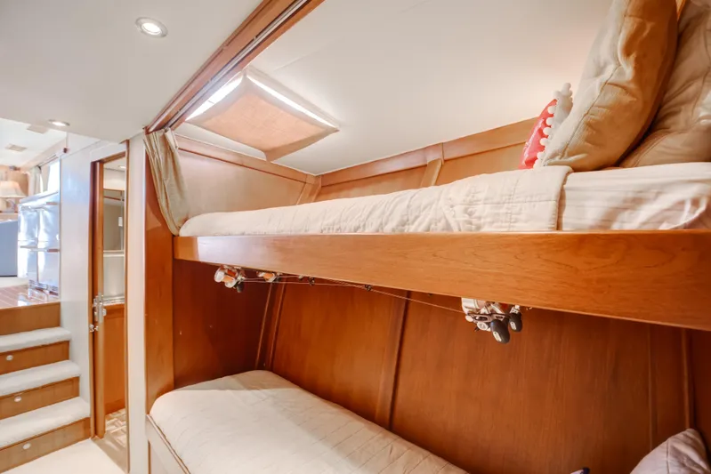 Spiros Yacht Photos Pics Interior of 1972 Jim Smith Custom Convertible with wooden bunk beds and cozy lighting.