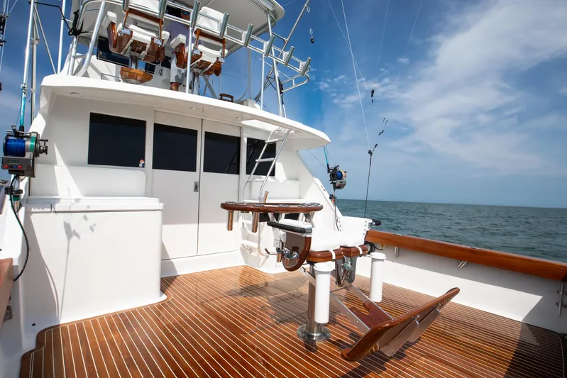 Spiros Yacht Photos Pics 1972 Jim Smith Custom Convertible boat with wooden deck, ocean view, and fishing equipment.