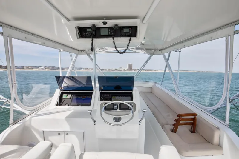 Spiros Yacht Photos Pics Interior of 1972 Jim Smith Custom Convertible boat with ocean view and navigation equipment.