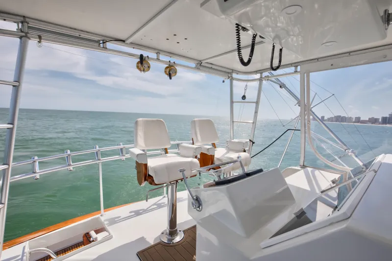 Spiros Yacht Photos Pics Helm of 1972 Jim Smith Custom Convertible yacht with ocean view.