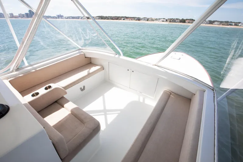 Spiros Yacht Photos Pics Luxurious 1972 Jim Smith Custom Convertible boat interior with beige seating and ocean view.