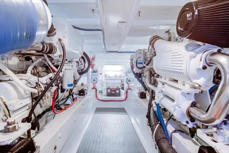 Spiros Yacht Photos Pics Engine room of a 1972 Jim Smith Custom Convertible boat, showcasing mechanical components.