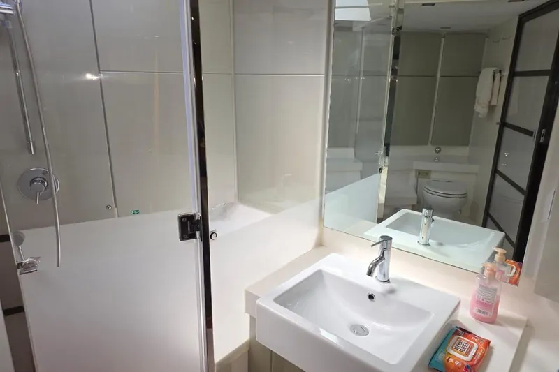  Yacht Photos Pics Luxurious bathroom in 2013 Fairline Targa 62 GT yacht with modern fixtures and amenities.