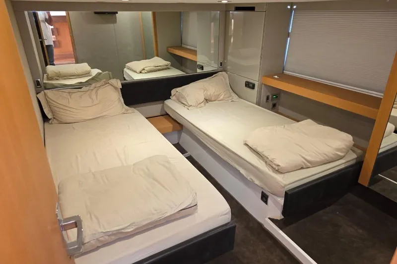  Yacht Photos Pics Interior cabin of 2013 Fairline Targa 62 GT yacht with twin beds and modern decor.