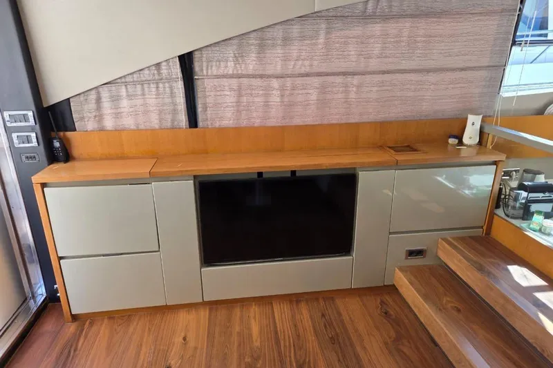  Yacht Photos Pics Interior of 2013 Fairline Targa 62 GT yacht with modern cabinetry and wooden flooring.