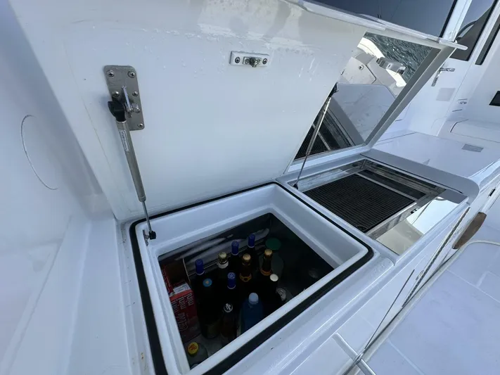 Off Season Yacht Photos Pics Built-in cooler with beverages on a 2006 Cabo 48 Convertible yacht deck.