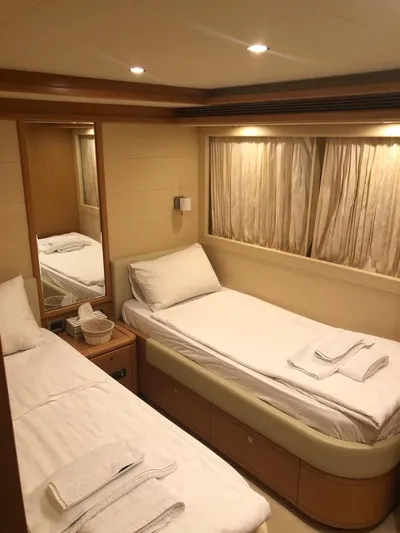 Mar Azul Yacht Photos Pics 2008 Ferretti Yachts 830 cabin with twin beds, elegant wood accents, and soft lighting.
