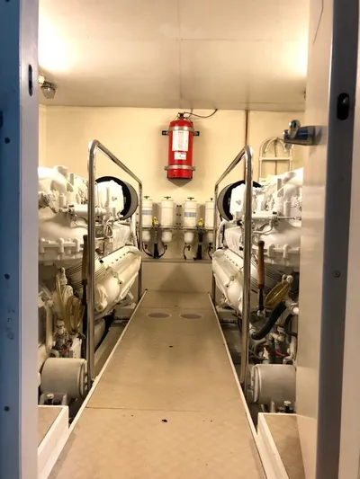 Mar Azul Yacht Photos Pics Engine room of 2008 Ferretti Yachts 830, featuring dual engines and safety equipment.