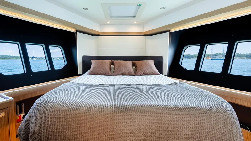 O Sea D Yacht Photos Pics Luxurious bedroom interior of 2017 Absolute 50 Fly yacht with large windows and elegant bedding.