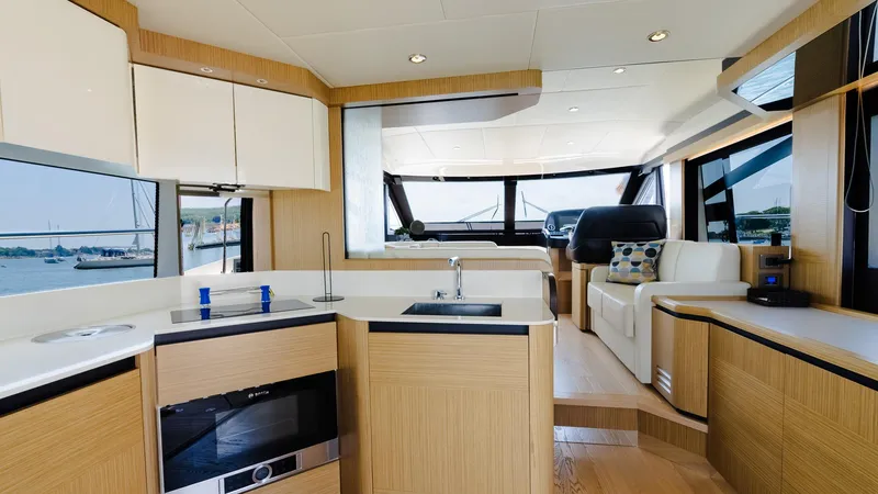 O Sea D Yacht Photos Pics Luxurious interior of 2017 Absolute 50 Fly yacht with modern kitchen and seating area.