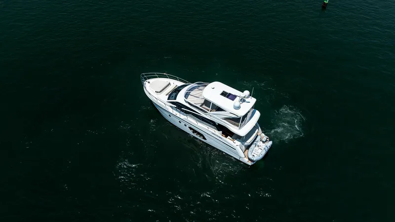 O Sea D Yacht Photos Pics Aerial view of 2017 Absolute 50 Fly yacht cruising on open water.