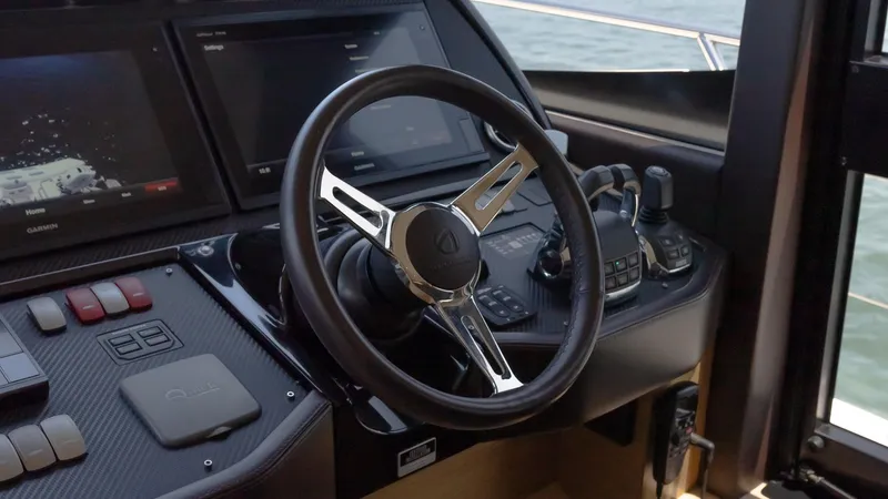 O Sea D Yacht Photos Pics Steering wheel and controls of a 2017 Absolute 50 Fly yacht cockpit.