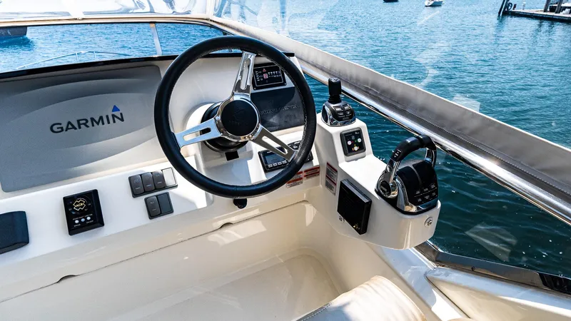 O Sea D Yacht Photos Pics Cockpit of 2017 Absolute 50 Fly yacht with Garmin navigation system, steering wheel, and controls.