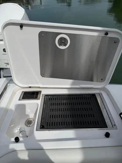  Yacht Photos Pics Outdoor grill and sink on 2023 Bertram 39 CC boat deck.