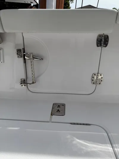  Yacht Photos Pics 2023 Bertram 39 CC boat interior with stainless steel hardware and white upholstery.