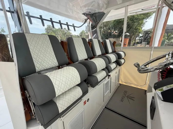  Yacht Photos Pics Luxury seating on 2023 Bertram 39 CC boat, featuring quilted upholstery and modern design.