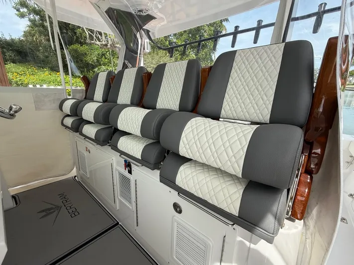  Yacht Photos Pics 2023 Bertram 39 CC boat interior with luxurious quilted seating and sleek design.