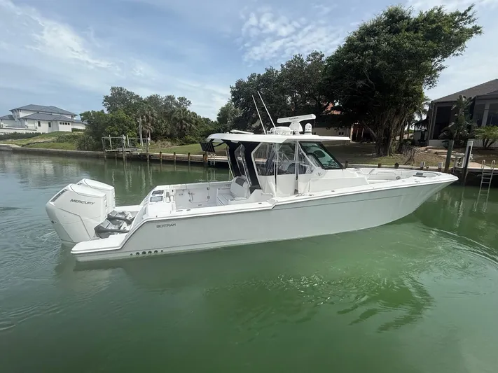  Yacht Photos Pics 2023 Bertram 39 CC boat with Mercury engines on calm water.