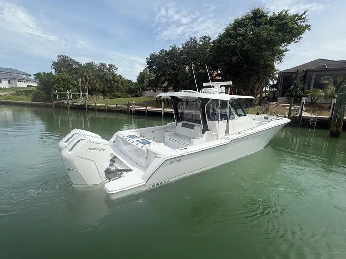  Yacht Photos Pics 2023 Bertram 39 CC boat with Mercury engines on calm water.