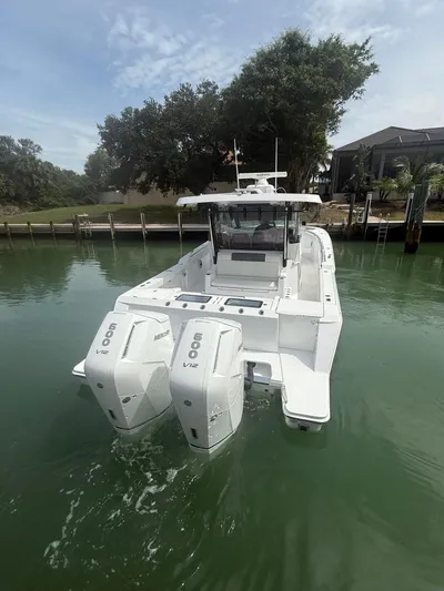  Yacht Photos Pics 2023 Bertram 39 CC boat with dual Mercury 600 V12 engines on calm water.