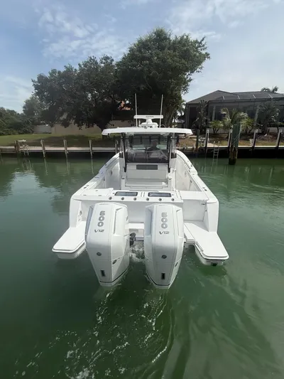  Yacht Photos Pics 2023 Bertram 39 CC boat with dual 600 V12 engines on calm water.
