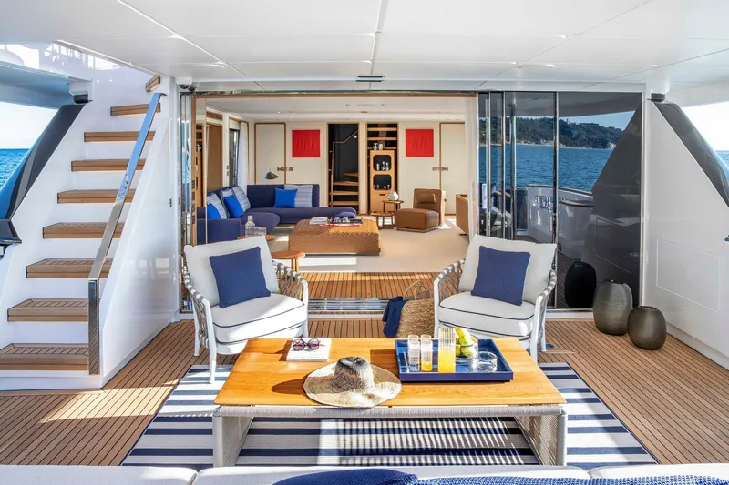  Yacht Photos Pics Luxurious 2023 Custom Line Navetta 30 yacht interior with elegant seating and ocean view.