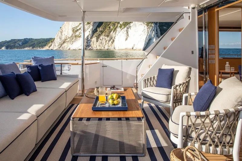  Yacht Photos Pics Luxurious 2023 Custom Line Navetta 30 yacht interior with elegant seating and ocean view.