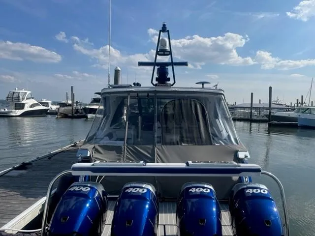  Yacht Photos Pics 2022 Formula 400 Super Sport Crossover boat docked with four 400 horsepower engines.