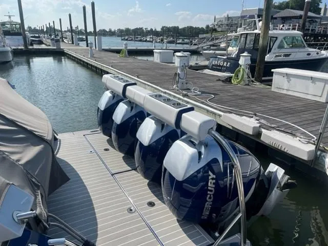  Yacht Photos Pics 2022 Formula 400 Super Sport Crossover with quad Mercury outboard engines docked at marina.