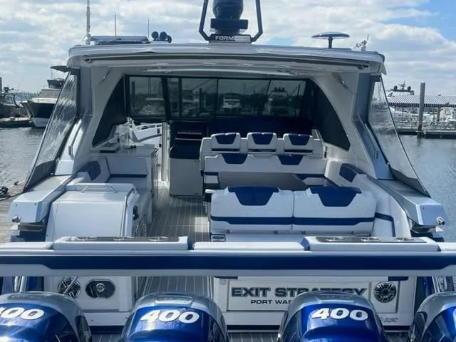  Yacht Photos Pics 2022 Formula 400 Super Sport Crossover boat with multiple outboard engines docked at a marina.