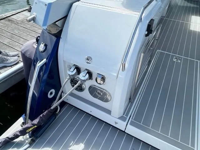  Yacht Photos Pics 2022 Formula 400 Super Sport Crossover boat docked, showing rear deck and utility connections.