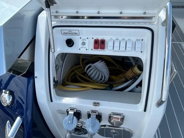  Yacht Photos Pics 2022 Formula 400 Super Sport Crossover electrical panel and storage compartment.