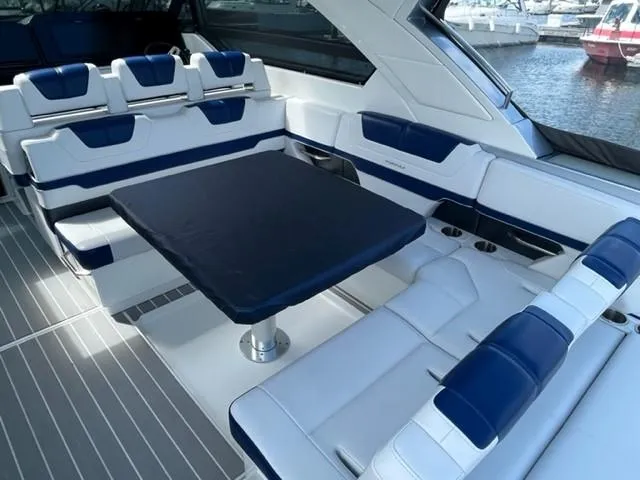  Yacht Photos Pics 2022 Formula 400 Super Sport Crossover boat interior with white and blue seating.