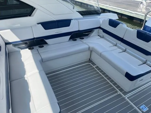  Yacht Photos Pics 2022 Formula 400 Super Sport Crossover boat interior with white and blue seating.