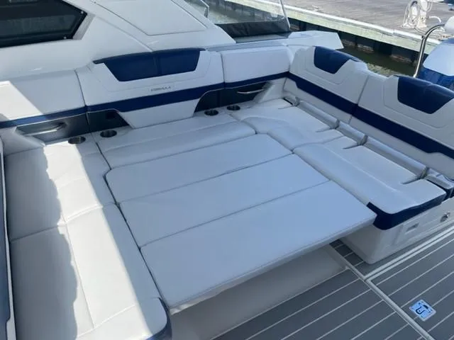  Yacht Photos Pics 2022 Formula 400 Super Sport Crossover boat with spacious white and blue seating.