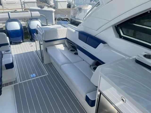  Yacht Photos Pics 2022 Formula 400 Super Sport Crossover boat interior with white and blue seating.