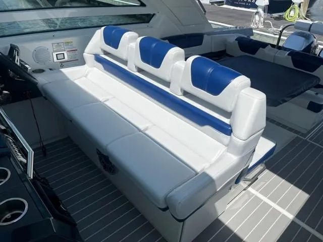  Yacht Photos Pics 2022 Formula 400 Super Sport Crossover boat interior with white and blue seating.