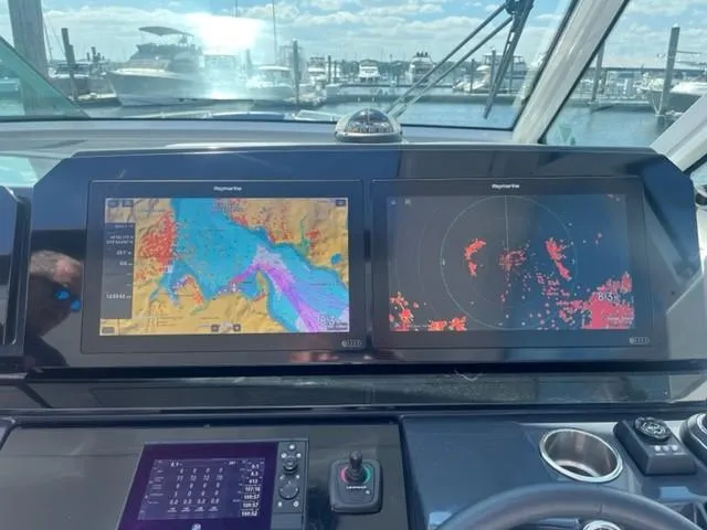  Yacht Photos Pics Dashboard of a 2022 Formula 400 Super Sport Crossover with navigation screens.