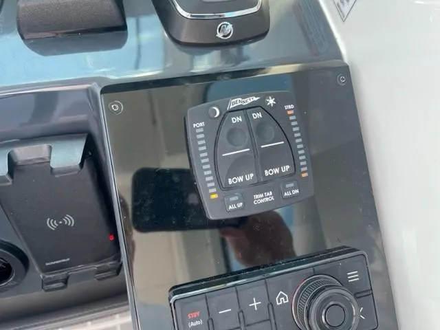  Yacht Photos Pics 2022 Formula 400 Super Sport Crossover boat control panel with trim tab controls.