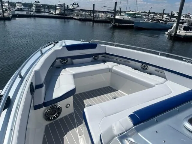  Yacht Photos Pics 2022 Formula 400 Super Sport Crossover boat with spacious seating at a marina.