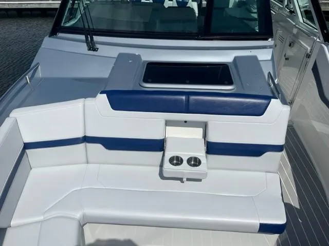  Yacht Photos Pics 2022 Formula 400 Super Sport Crossover boat with white and blue seating.