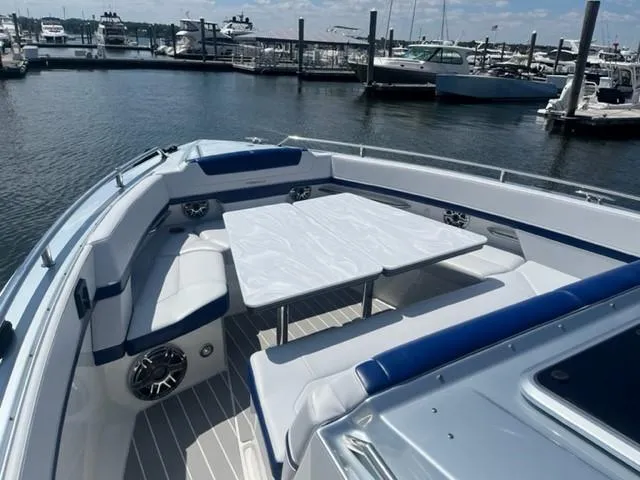  Yacht Photos Pics 2022 Formula 400 Super Sport Crossover boat with spacious seating and table at marina.