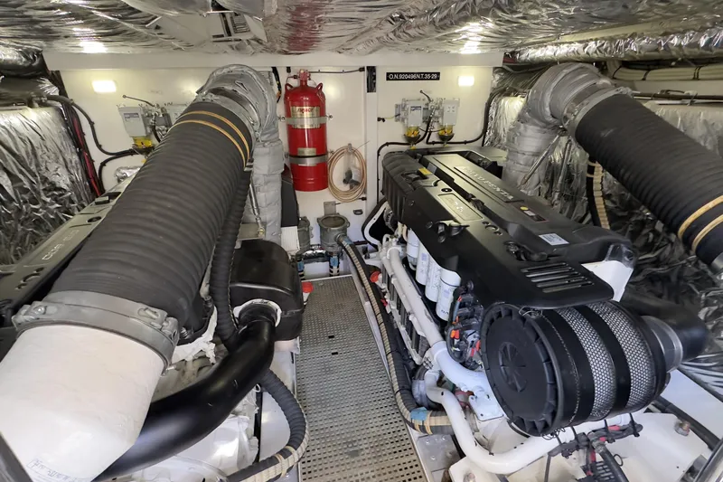  Yacht Photos Pics Engine room of a 2014 Princess 56 yacht with dual engines and fire extinguisher.