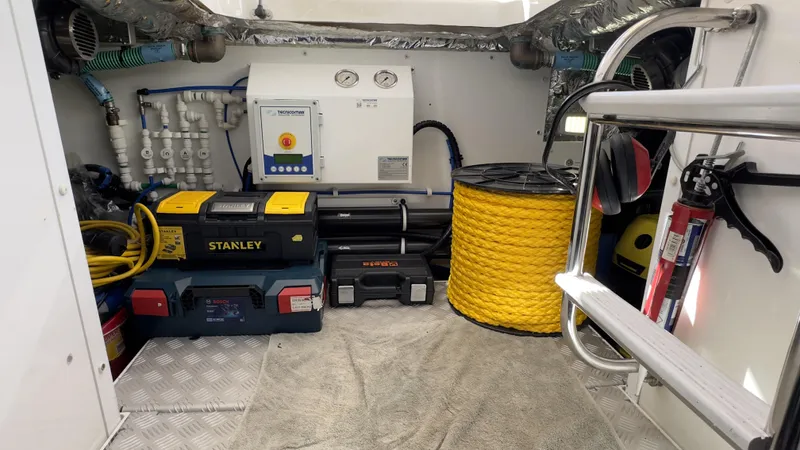  Yacht Photos Pics Engine room of a 2014 Princess 56 yacht with tools and equipment.