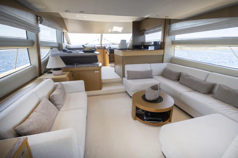  Yacht Photos Pics Luxurious interior of 2014 Princess 56 yacht with elegant seating and panoramic windows.