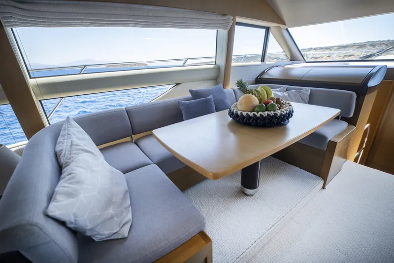  Yacht Photos Pics Luxurious interior of 2014 Princess 56 yacht with elegant dining area and sea view.